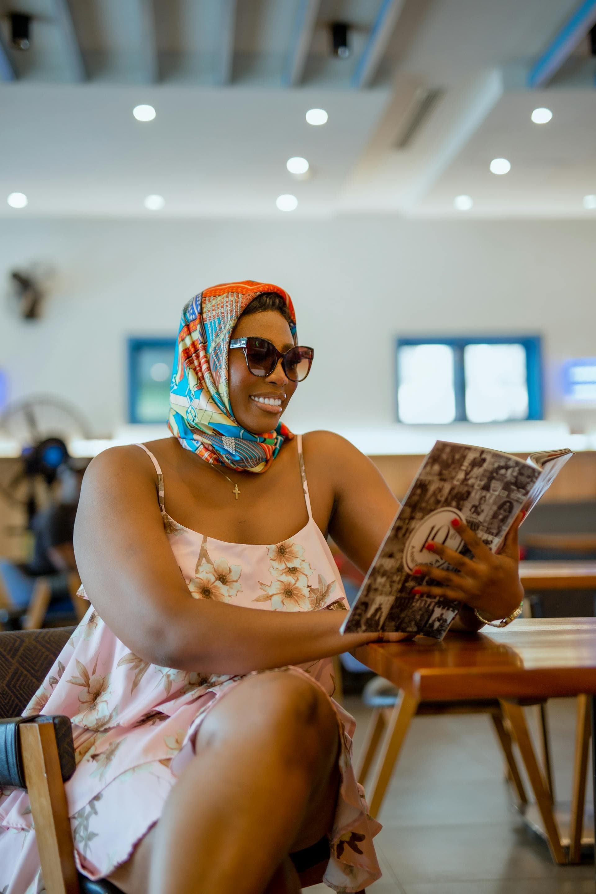 Reader studying a magazine in a cafe