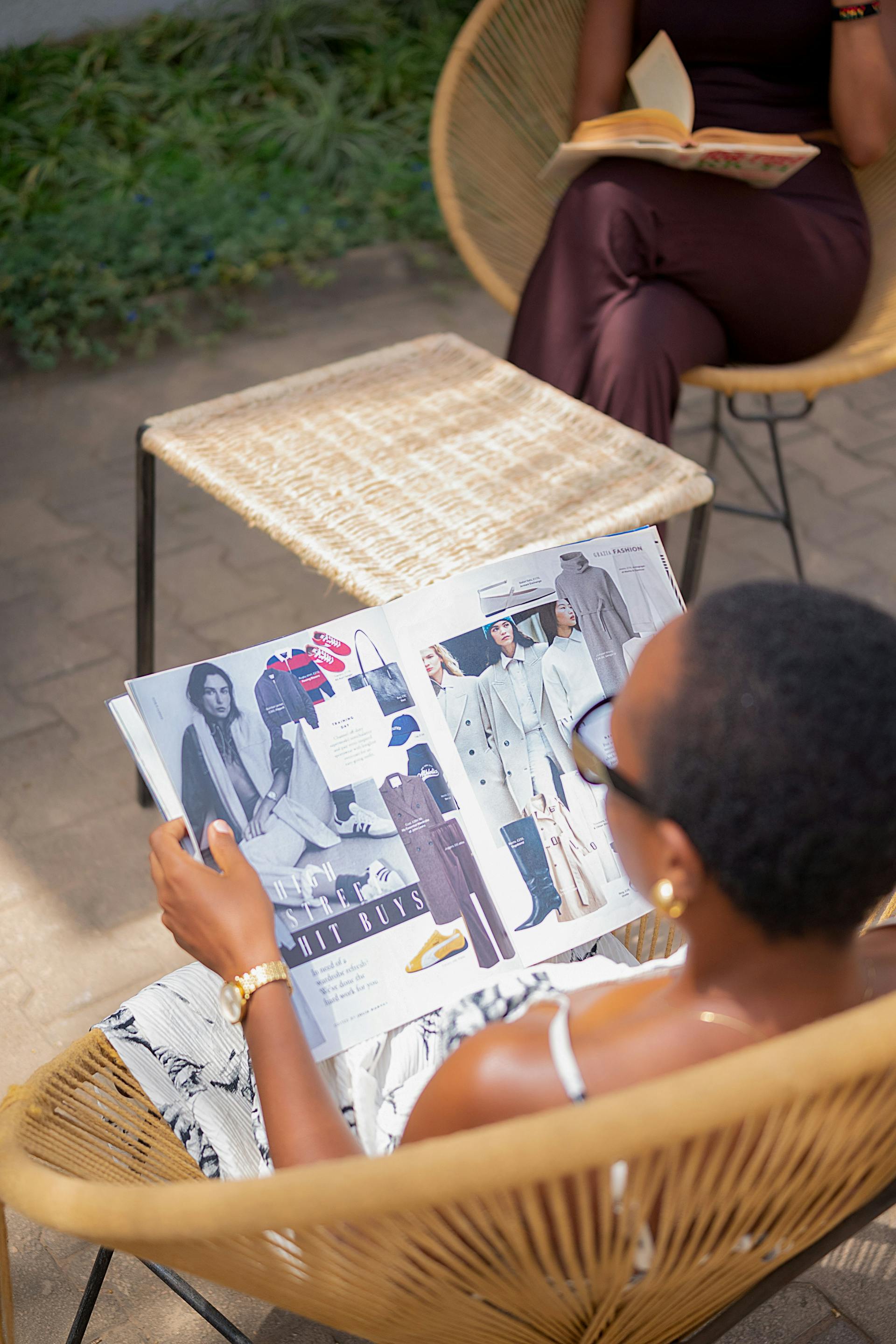 Open editorial magazine spread held above a cafe table